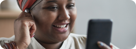 Woman Using Mobile Device Connected To Microwave Internet