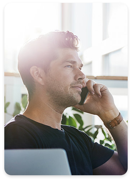 Man Using Mobile Device Connected to Router