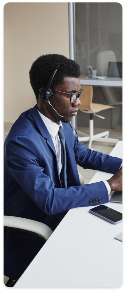 Man With Headsets On Cloud PBX Call